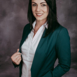 A portait photo of Mari-Louise du Plessis who is a real estate agent in Namibia.
